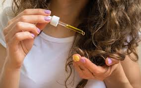 Collection of the best natural oils for hair growth including coconut, castor, rosemary, argan, almond, olive, and jojoba oil