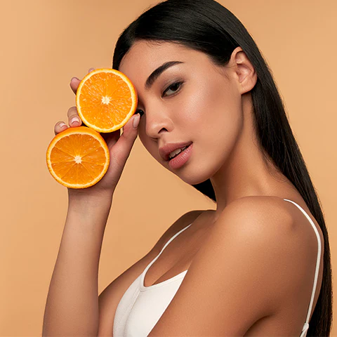 Woman following summer skincare routine to prevent open pores.
